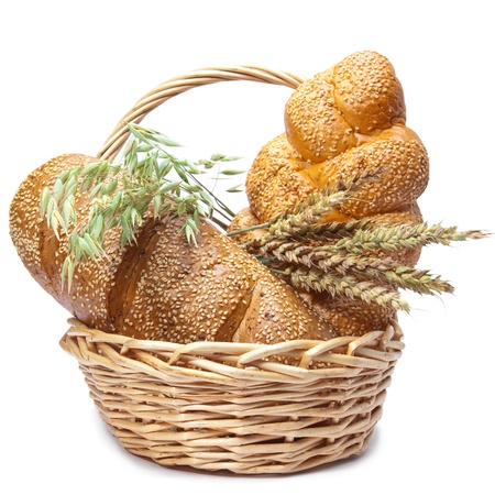 Basket with bread on white backgroundの写真素材