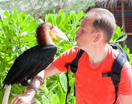 Portrait of the man with a toucan

の写真素材