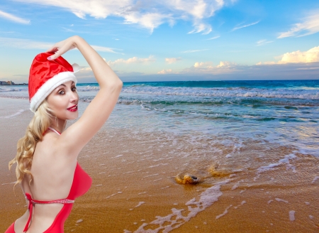 The young woman in the New Year's cap on a beachの写真素材