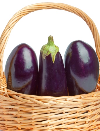 basket and three ripe eggplantの写真素材