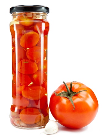 canned tomatoes in glass jarsの写真素材