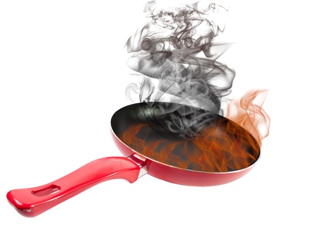 red frying pan with a smoke and fire