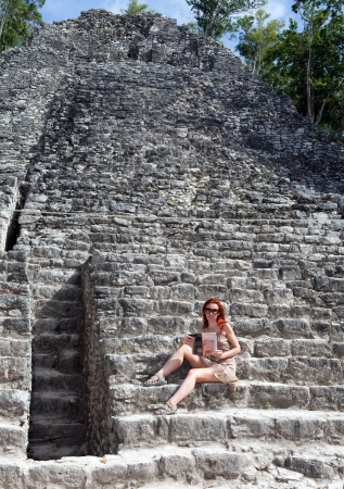The tourist against pyramid ruins Mexico  Archeologic zone Kabah の写真素材