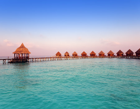 Island in ocean, Maldives.  Sunset.のeditorial素材