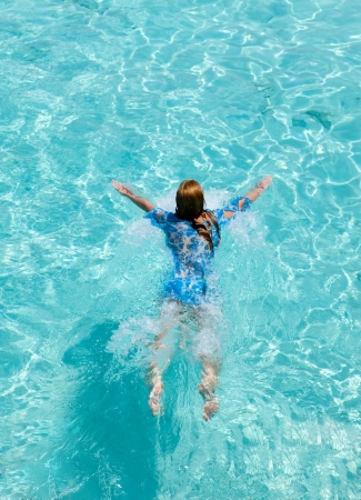 Young woman swiming in seaの写真素材