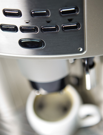 coffee maker and cup, small depth of sharpnessの写真素材