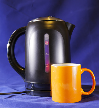 electric tea kettle and a mugの写真素材