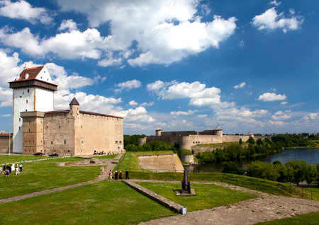 Two ancient fortresses on the parties from the river which is border. Narva, Estonia and Ivangorod behind the river, Russia.のeditorial素材