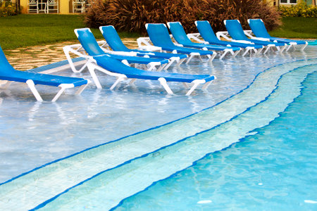 Empty beach chairs near  poolのeditorial素材