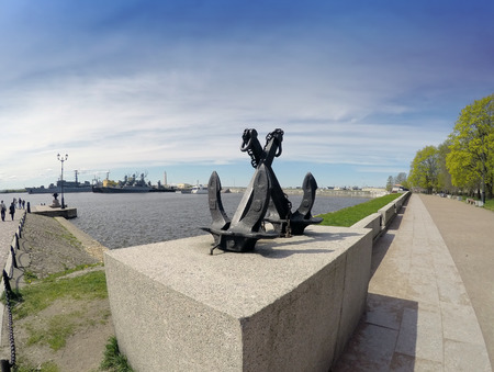 A monument - old sea crossed anchors on the background of Peter's harbour. Kronstadt, St. Petersburg, Russiaの写真素材
