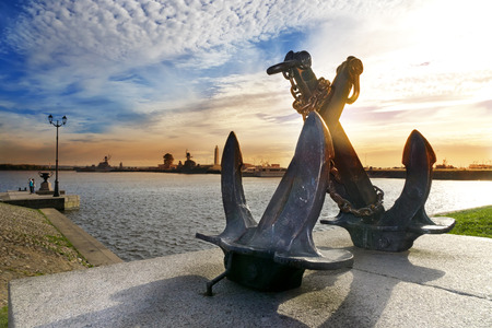 silhouette of old sea crossed anchors on the background of Peter's harbour. Kronstadt, St. Petersburg, Russiaの写真素材