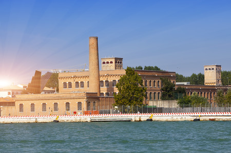Venice, Italy. Ancient industrial buildings on the bank of the channel.の写真素材