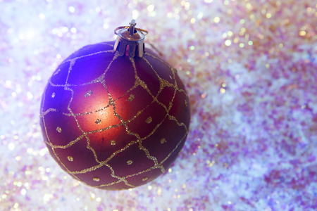 New Year's ball on a background of decorative snowの写真素材