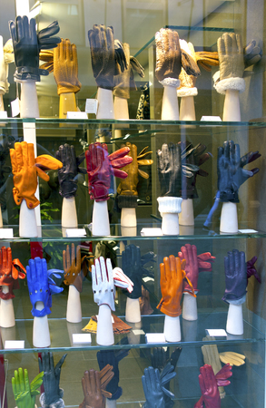 VENICE, ITALY - SEPTEMBER 24,  2010: bright gloves on a window of shopの写真素材
