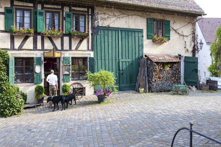 Beautiful traditional houses on the street of the small city in Bavaria, Germany.の写真素材