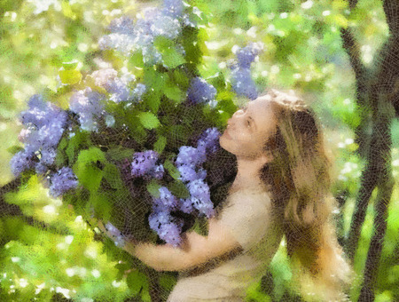 happy young woman in park with a big bouquet of a lilacの写真素材