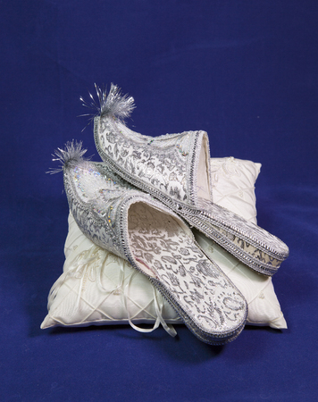 east style bride wedding shoes on a blue velvetの写真素材
