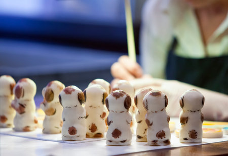 TALLINN, ESTONIA- JUNE 17-2012:the woman paints figures in shop at the museum of marzipansのeditorial素材