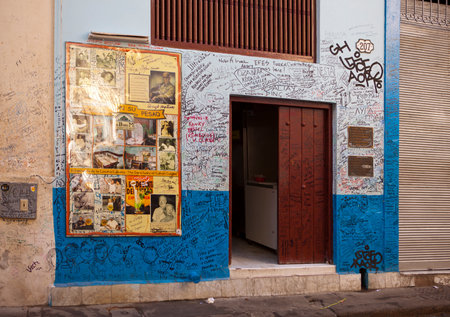 HAVANA, CUBA - JANUARY 27, 2013: Restaurant Bodeguita del Medio. Poster with autographs about an entrance.  This restaurant was favourite of Ernest Hemingway and other celebritiesのeditorial素材