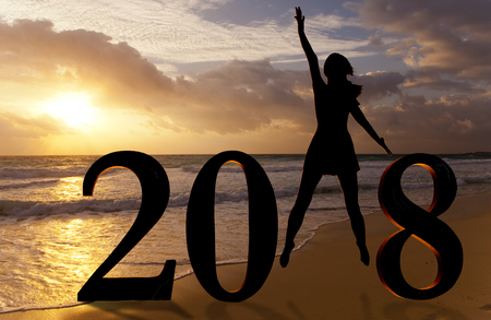 Happy new year card 2018. Silhouette of young woman on the beach as a part of the Number 2018 sign.

の写真素材