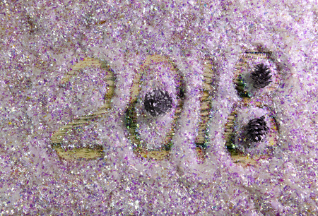 New Year inscription 2018 is written by a finger on brilliant beautiful artificial snowの写真素材