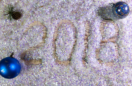 New Year inscription 2018 is written by a finger on brilliant beautiful artificial snow

の写真素材