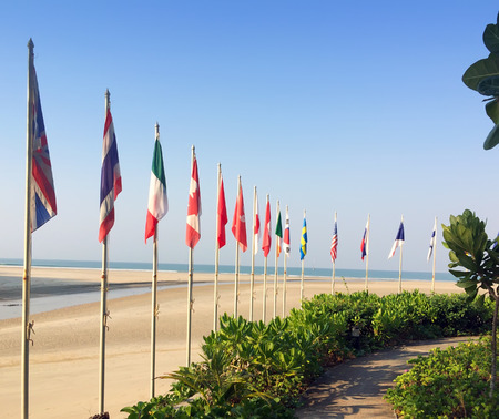sandy beach and flags of the different countries on the seashore. Thailand

の写真素材