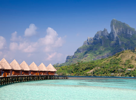 beautiful tropical Maldives island, water villas, bungalow on sea and the mountain on a backgroundのeditorial素材