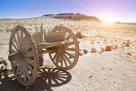 An old wooden cart on two wagon wheels in the Kyzyl Kum desert, Uzbekistanの写真素材
