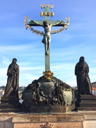 Sculpture Calvary on the Charles Bridge. Virgin Mary and John theologian near the crucifix. Czech. Pragueの写真素材