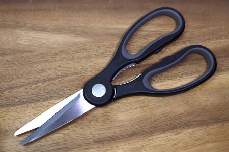 Kitchen, culinary scissors on a wooden tableの写真素材