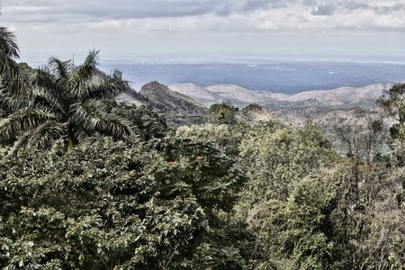 Cuba. View from a hill covered with jungle to the highlands and sea on the horizonの写真素材