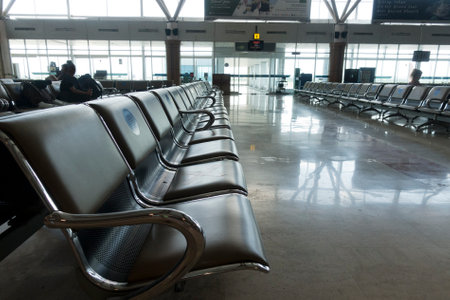 INDONESIA, ISLAND LOMBOK-MARCH 28, 2020: empty seats in the airport hall during the coronavirus, on the seats marking with a request not to occupy neighboring placesのeditorial素材