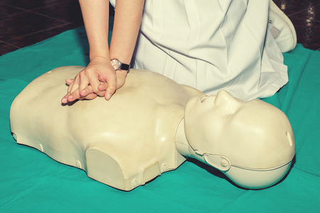 CPR training medical procedure - Demonstrating chest compressionの写真素材