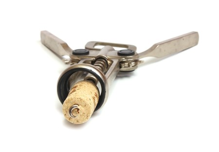 silve corkscrew and cork isolated on white backgroundの写真素材