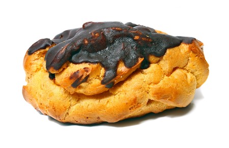 pastry in a chocolate isolated on white backgroundの写真素材