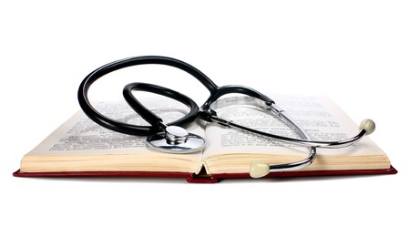 book and stethoscope isolated on white backgroundの写真素材