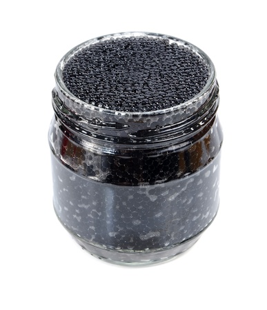 caviar black in a glass jar with lemon and parsley isolated on white backgroundの写真素材
