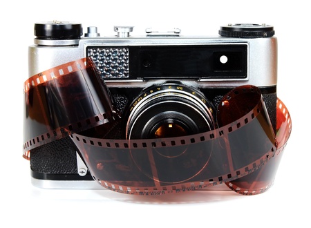 old retro photo camera and film isolated on white backgroundの写真素材
