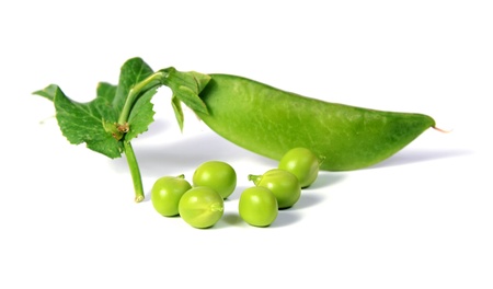 ripe peas with green leaf isolated on white backgroundの写真素材