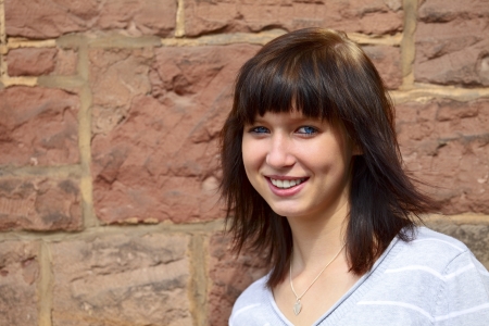 Outdoor portrait of a young girl  in a small city Dillingen, Saarland   Germanyの写真素材