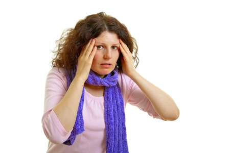 Young brown-haired woman with wool scarf has headache, isolated on white background, studio shot  Adobe RGBの写真素材