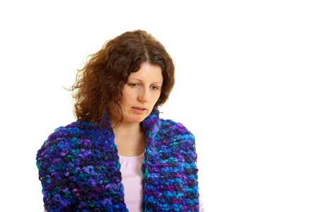 Young brown-haired woman with wool scarf isolated on white backgroundの写真素材