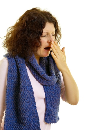 Young woman with brown hair  yawns, isolated on white backgroundの写真素材