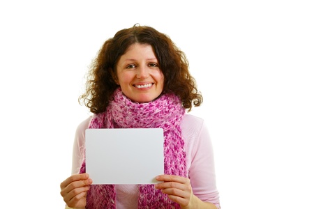 Young brown-haired woman with empty white panel isolated on white background, studio shot.の写真素材