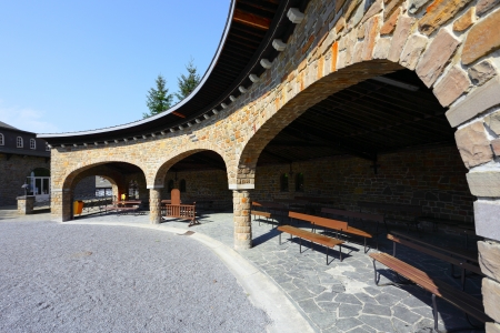 An interesting design of the exterior wall, a small building in the village Banneux, Belgiumの写真素材