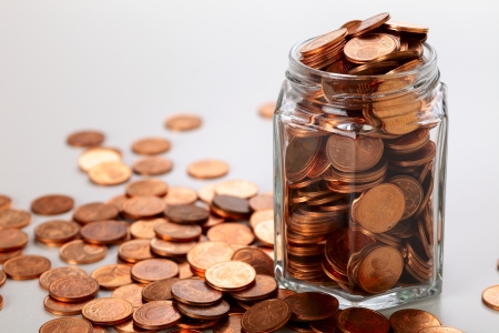 Euro  cent coins  in a small jar, studio shotの写真素材