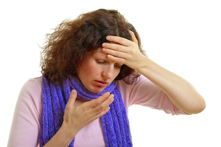 Young woman with brown hair has a flu and headache, isolated on white background, studio shot. Adobe RGBの写真素材