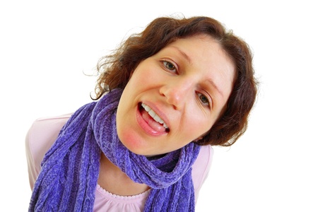 Young brown-haired woman with wool scarf isolated on white background, studio shot.の写真素材