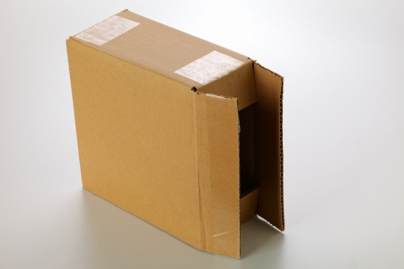 A cardboard box isolated on grey backgroundの写真素材